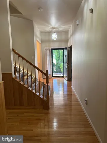 a view of entryway with wooden floor