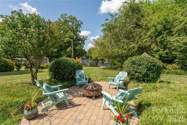 a view of a lake with couches in the patio