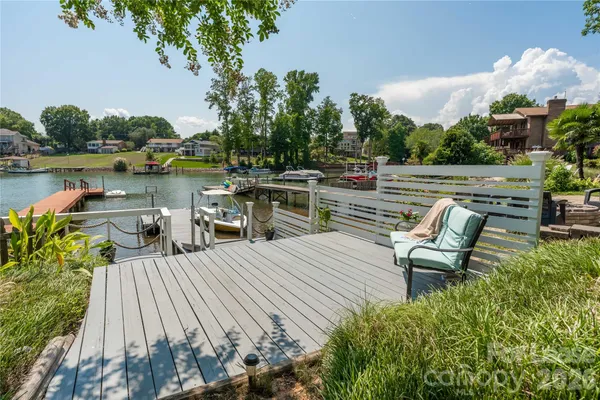 a view of a lake with furniture