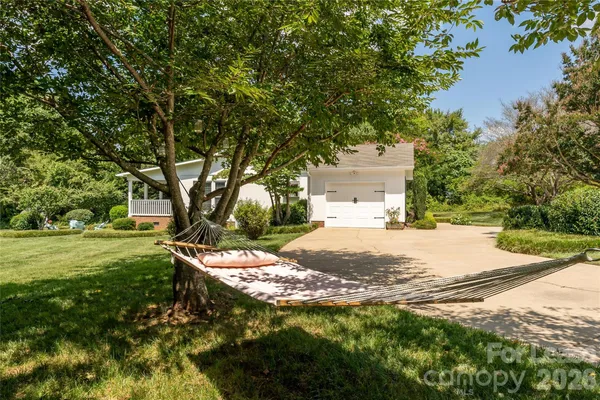 an aerial view of residential house with outdoor space and swimming pool