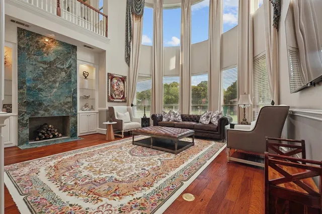 a living room with furniture windows and a fireplace