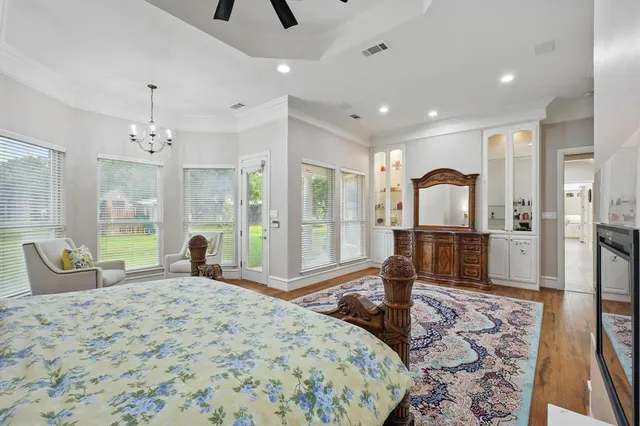 a bedroom with a large bed and a large window