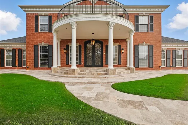 a view of a house with a small yard
