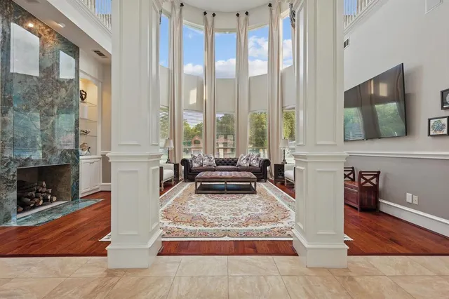 a living room with large furniture and a fireplace