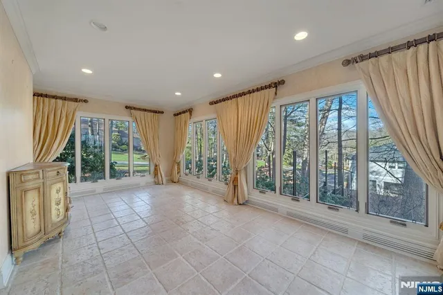 a living room with furniture a dining table and kitchen view