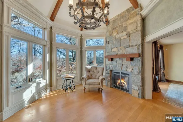 a living room with fireplace furniture and a fireplace