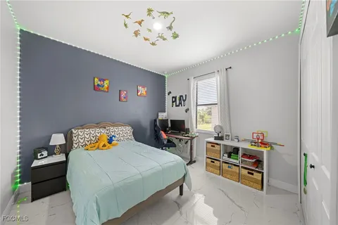 a bedroom with a bed and furniture