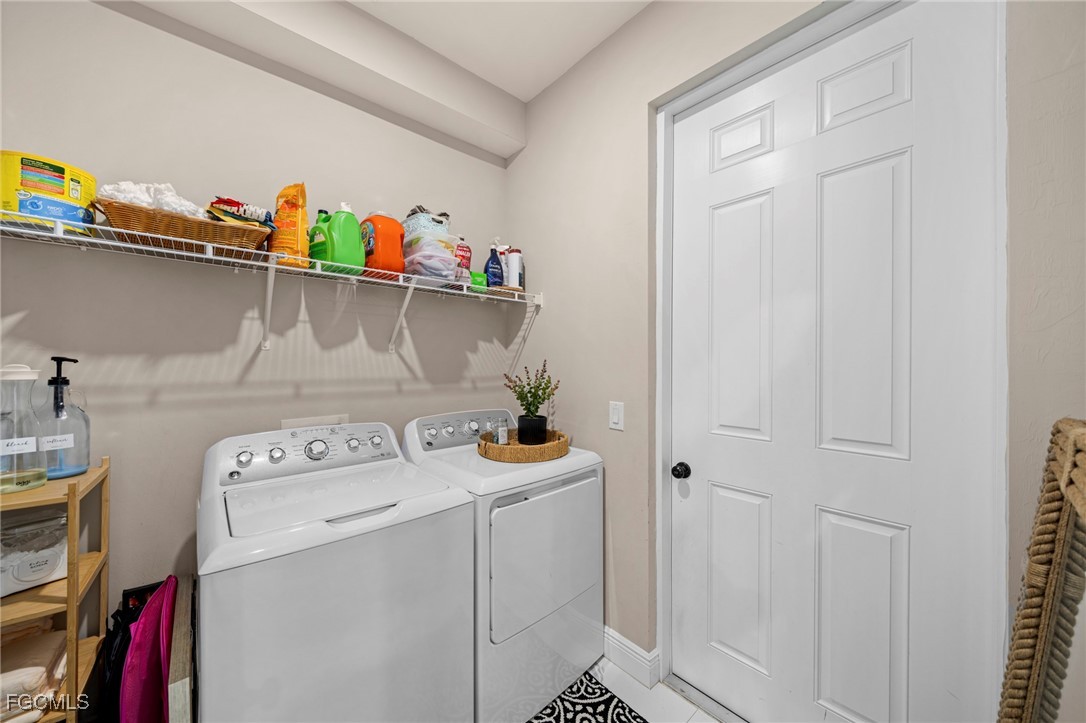 3713 25th Street Southwest Lehigh Acres, FL 33976 - Photo 23 of 31 a utility room with dryer and washer