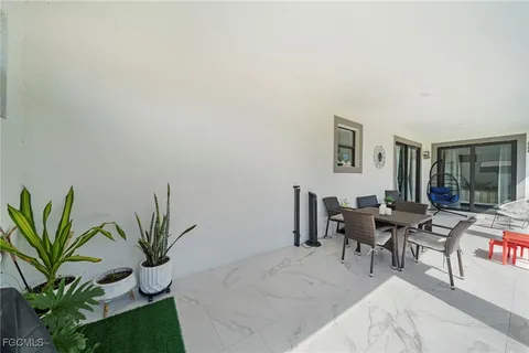 a workspace with furniture and a potted plant