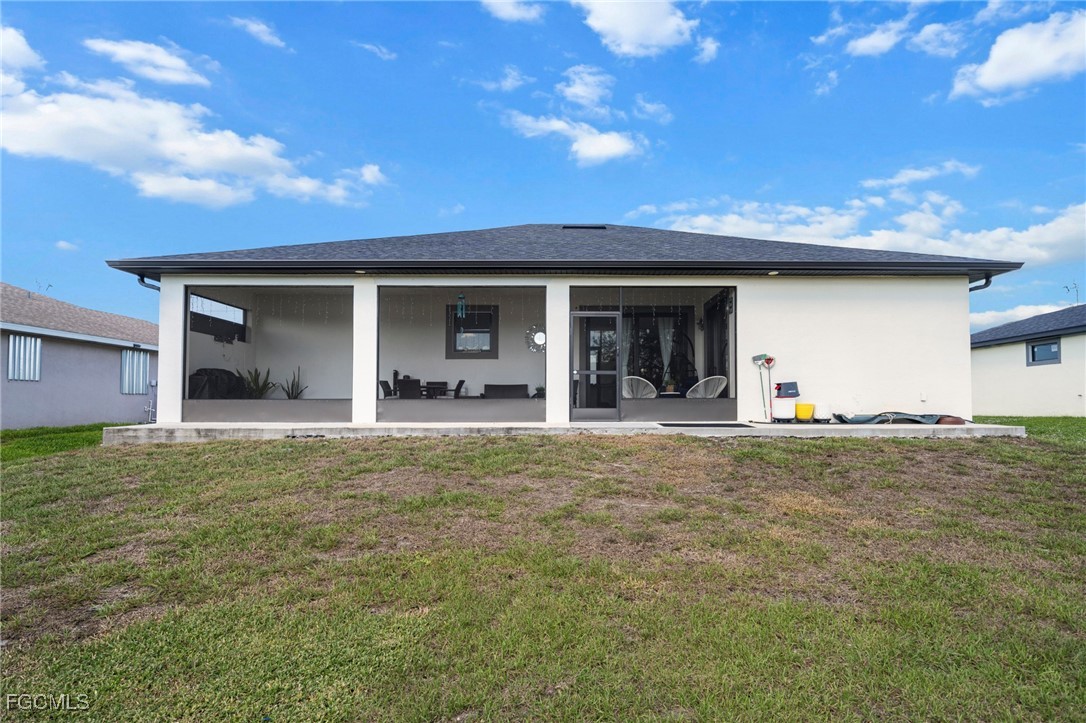 3713 25th Street Southwest Lehigh Acres, FL 33976 - Photo 28 of 31 a house view with a garden space