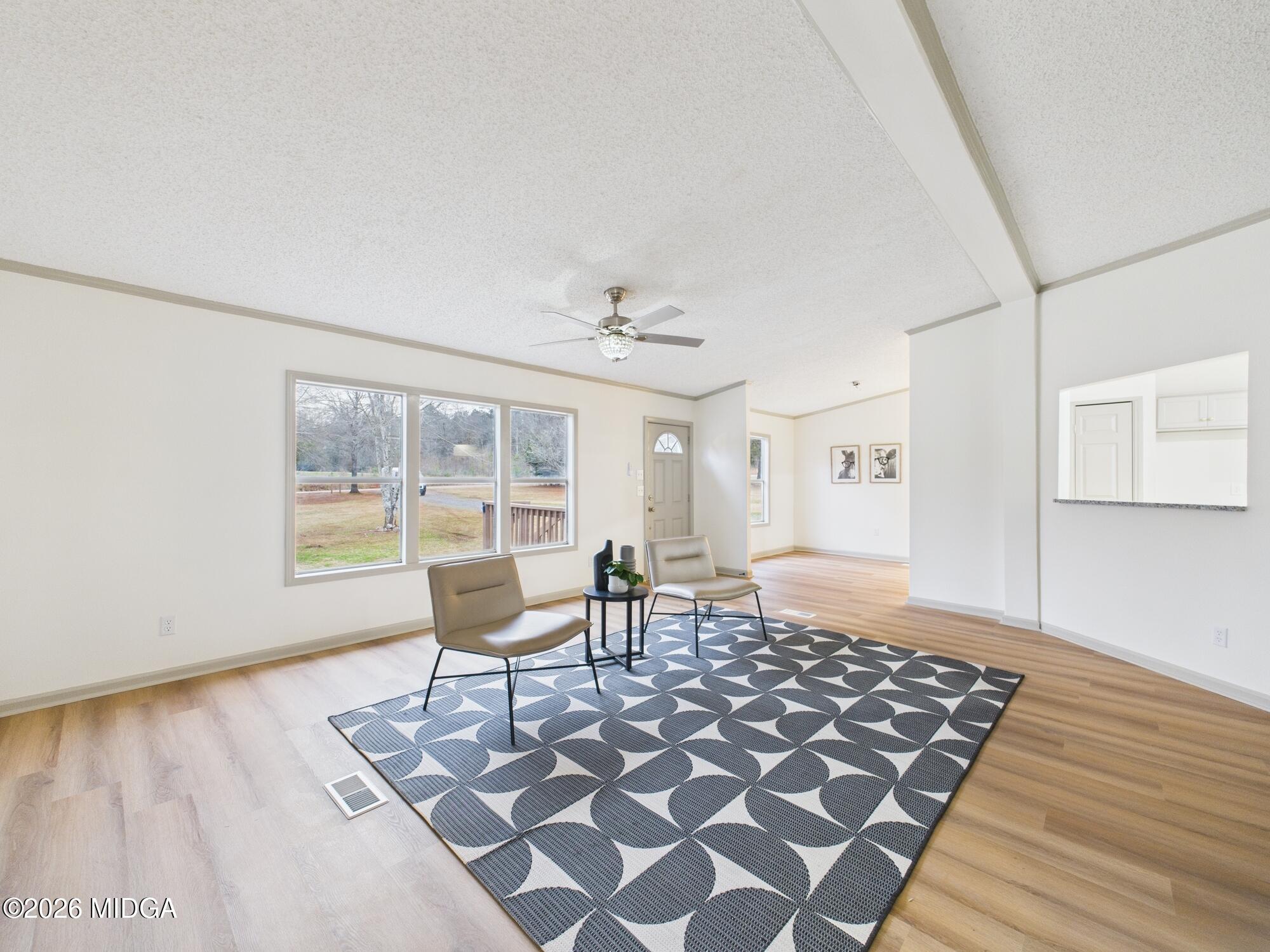 1850 Stallings Road Haddock, GA 31033 - Photo 11 of 44 a living room with a couch and a table
