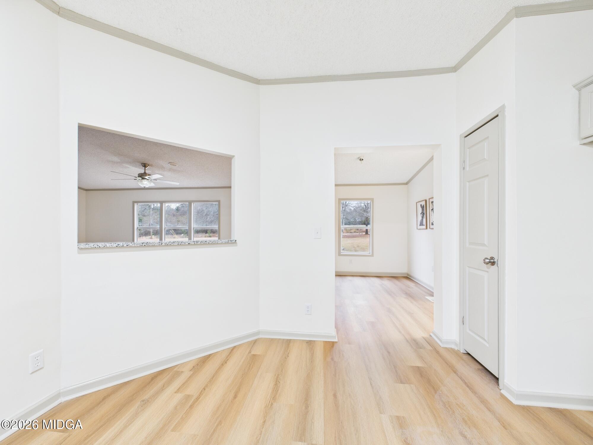 1850 Stallings Road Haddock, GA 31033 - Photo 17 of 44 a view of an empty room with wooden floor