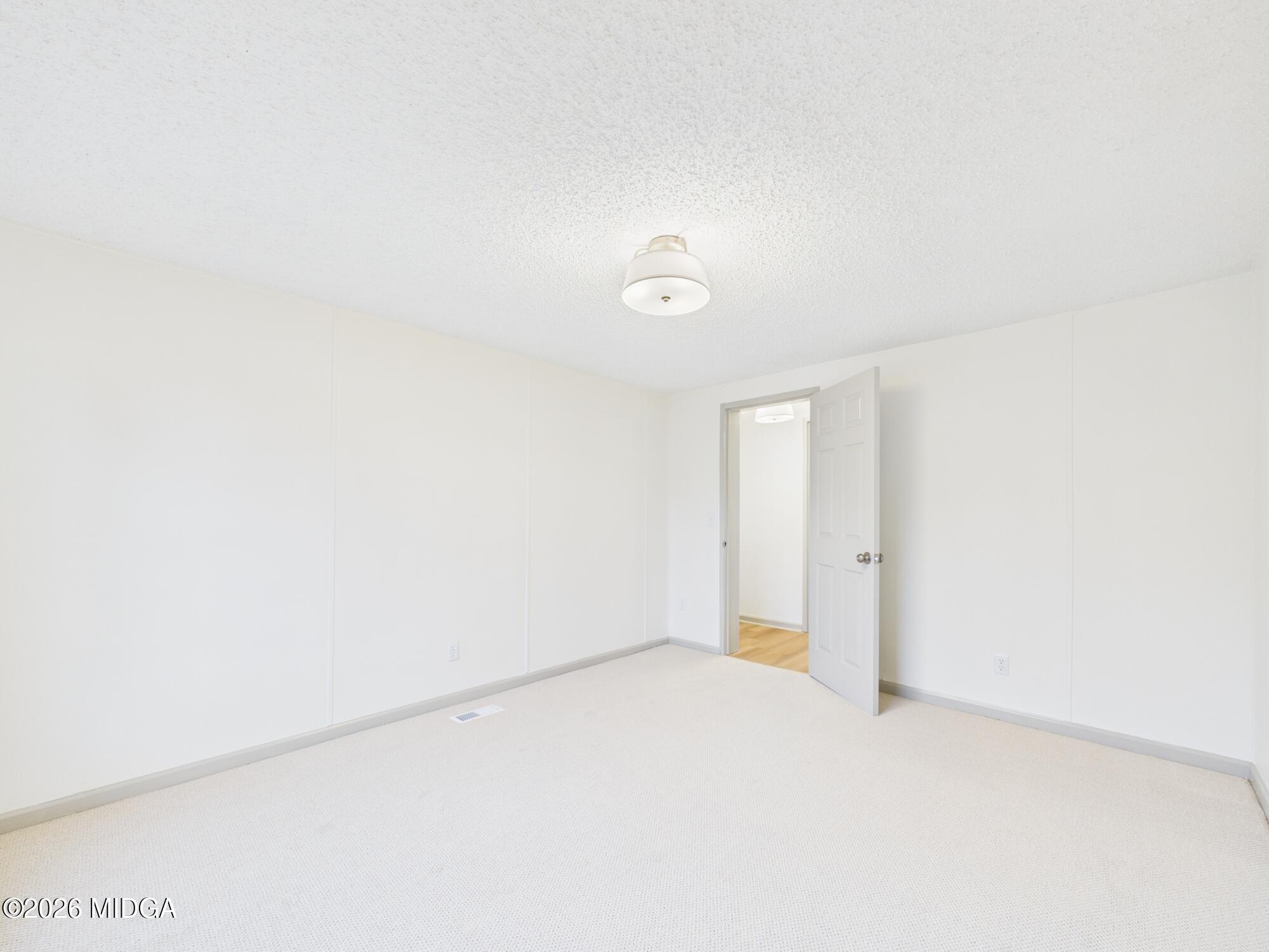 1850 Stallings Road Haddock, GA 31033 - Photo 19 of 44 a view of an empty room