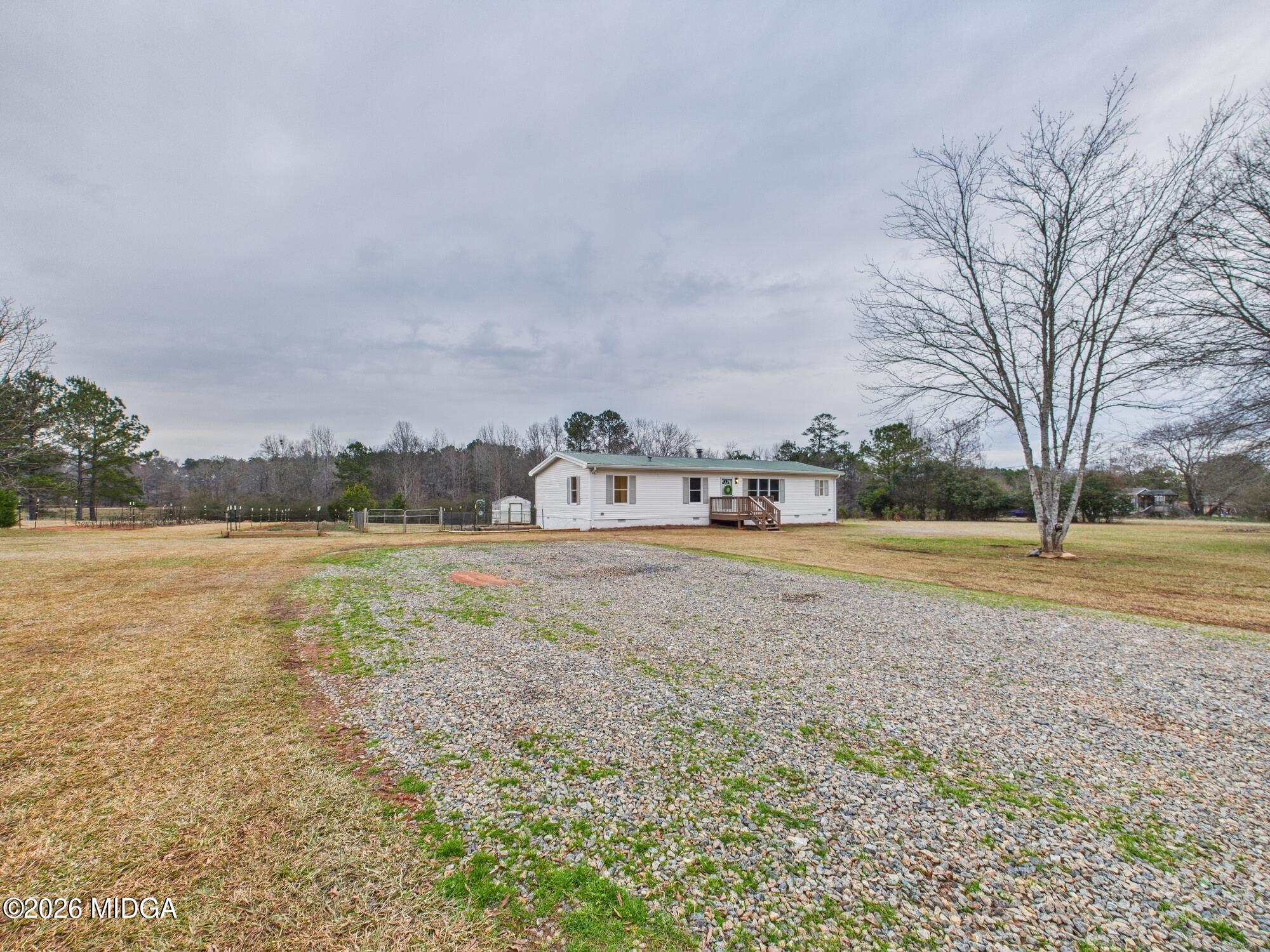 1850 Stallings Road Haddock, GA 31033 - Photo 2 of 44 a view of house with outdoor space