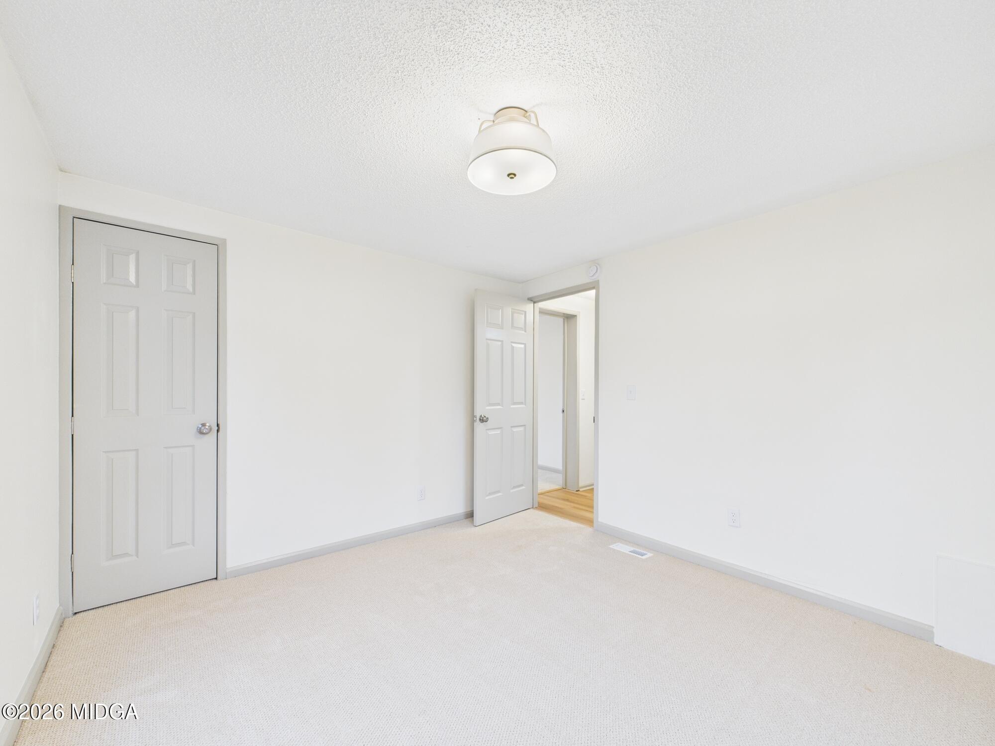 1850 Stallings Road Haddock, GA 31033 - Photo 21 of 44 a view of an empty room