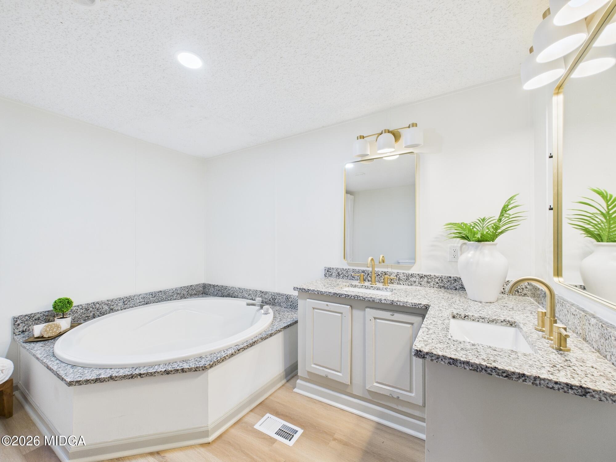 1850 Stallings Road Haddock, GA 31033 - Photo 29 of 44 a bathroom with a granite countertop sink and a mirror