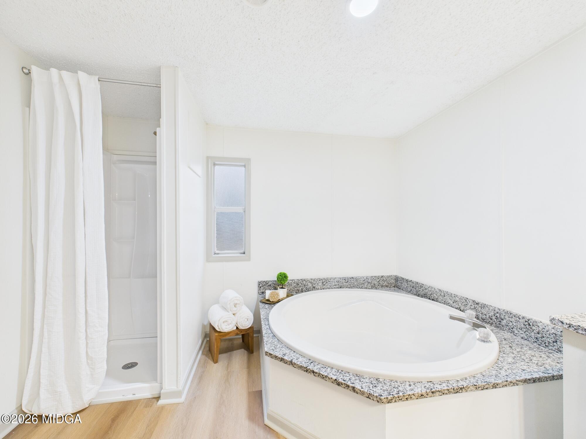 1850 Stallings Road Haddock, GA 31033 - Photo 30 of 44 a view of a bathroom with a bathtub