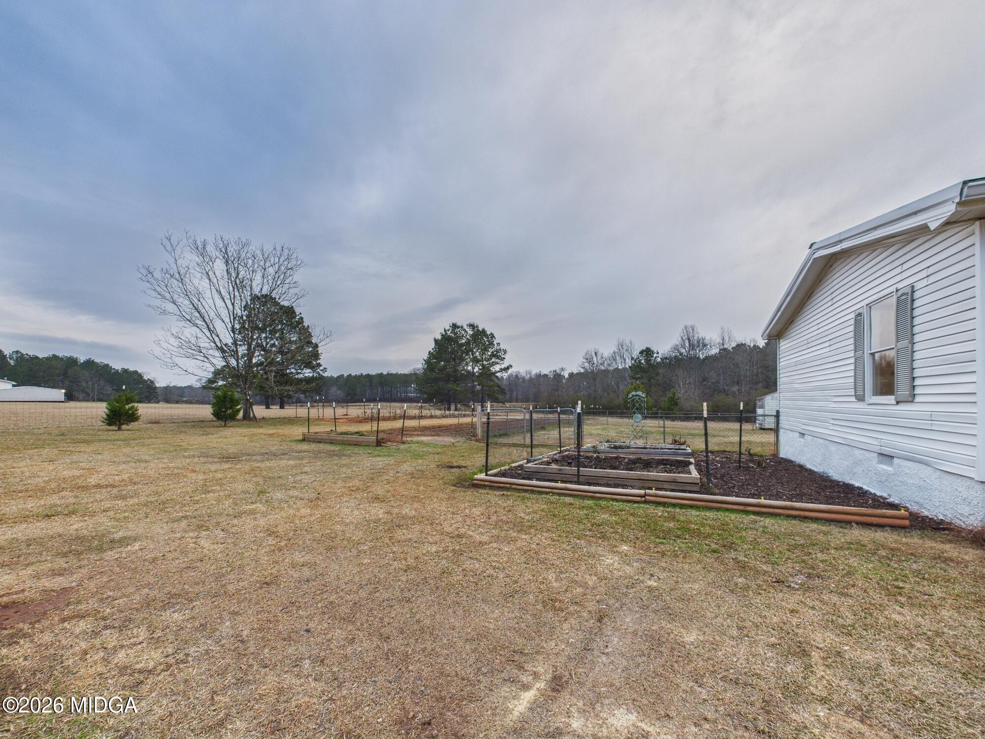 1850 Stallings Road Haddock, GA 31033 - Photo 42 of 44 a view of a house with a yard