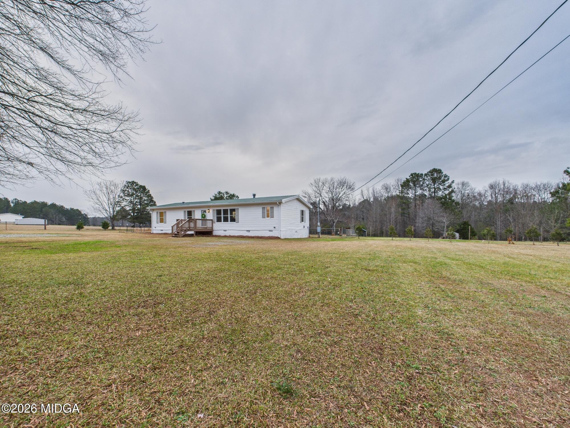 1850 Stallings Road Haddock, GA 31033 - Photo 5 of 44 a view of a house with a yard