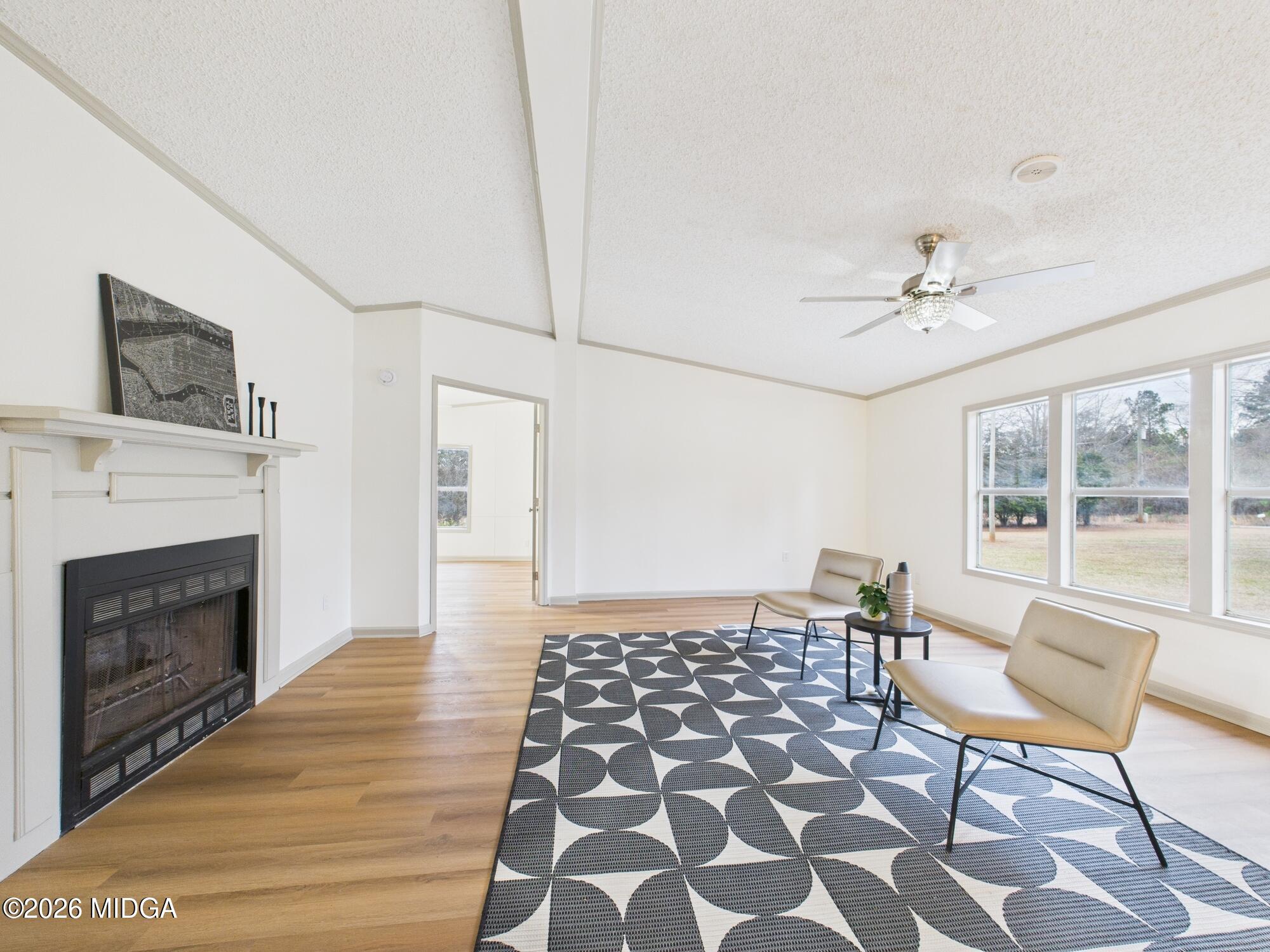 1850 Stallings Road Haddock, GA 31033 - Photo 9 of 44 a living room with furniture and a fireplace
