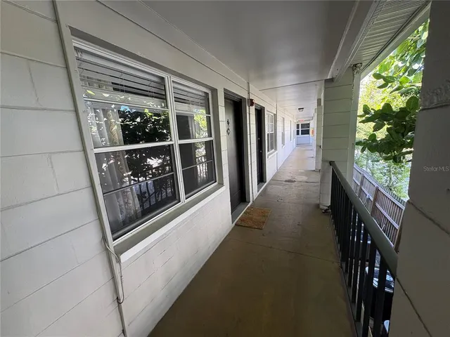 a view of a hallway with windows