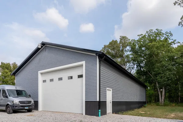 a view of a car parked in front of a house
