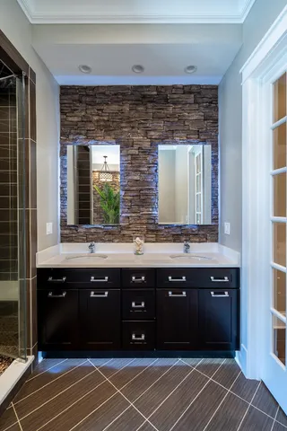 a open kitchen with stainless steel appliances granite countertop a stove a refrigerator a kitchen island a dining table and chairs with wooden floor