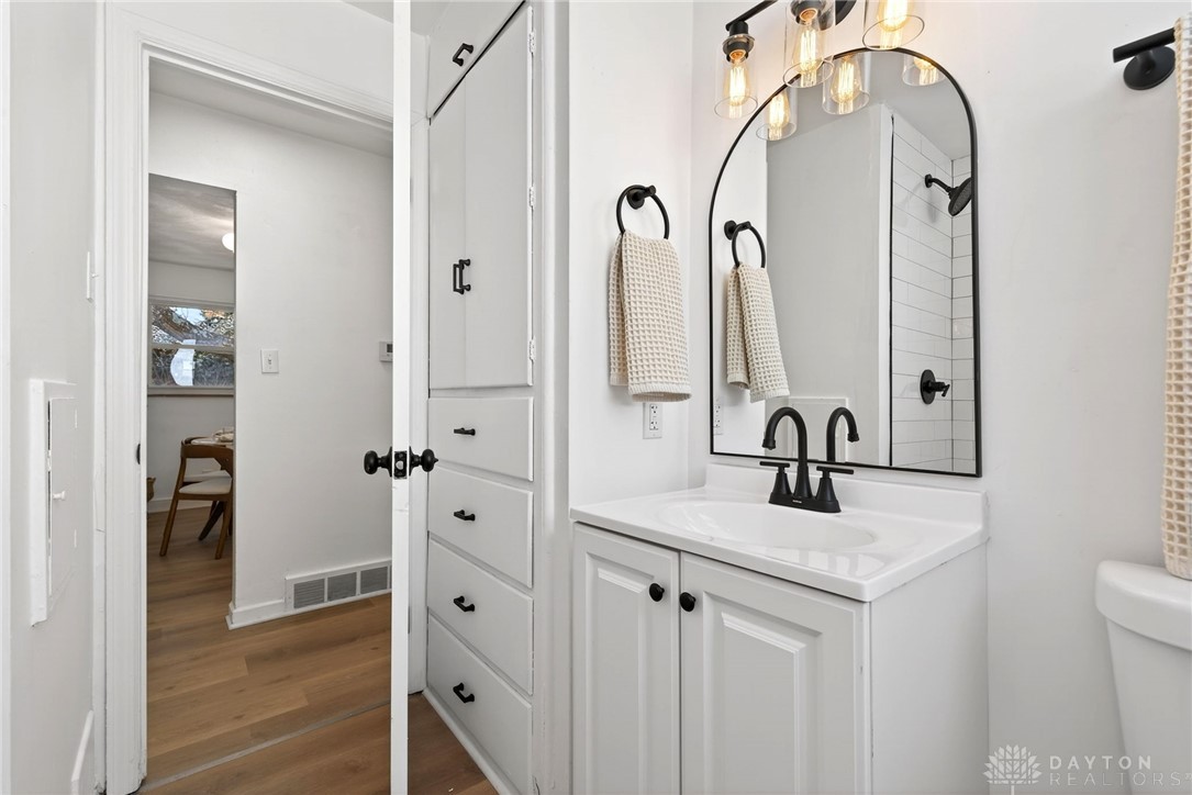 1243 Ridgeview Avenue Dayton, OH 45409 - Photo 24 of 56 This bright bathroom features a modern vanity with elegant fixtures.