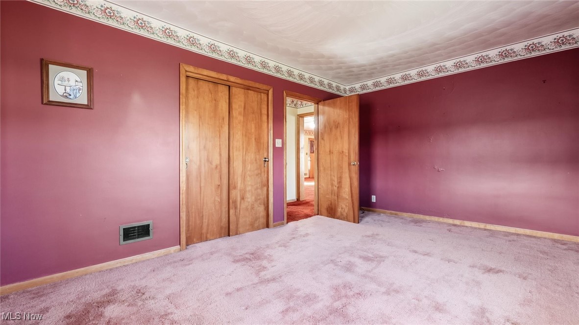 1950 Newark Road Zanesville, OH 43701 - Photo 18 of 39 Unfurnished bedroom with carpet and a closet
