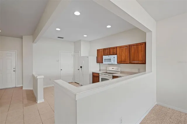 a kitchen with stainless steel appliances a sink and a refrigerator