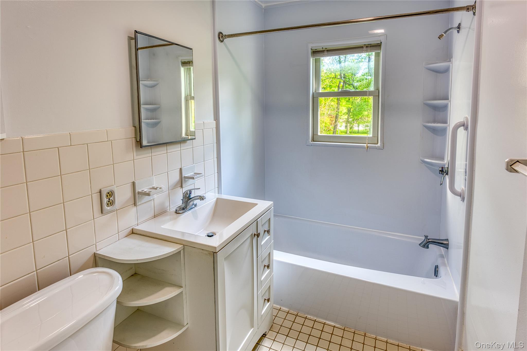 61 Indian Brook Road Garrison, NY 10524 - Photo 19 of 23 a bathroom with a sink a toilet and shower