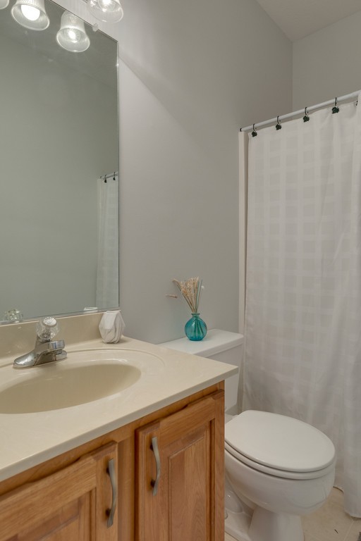 3501 Greens Mill Road Spring Hill, TN 37174 - Photo 13 of 16 a bathroom with a granite countertop sink mirror and toilet