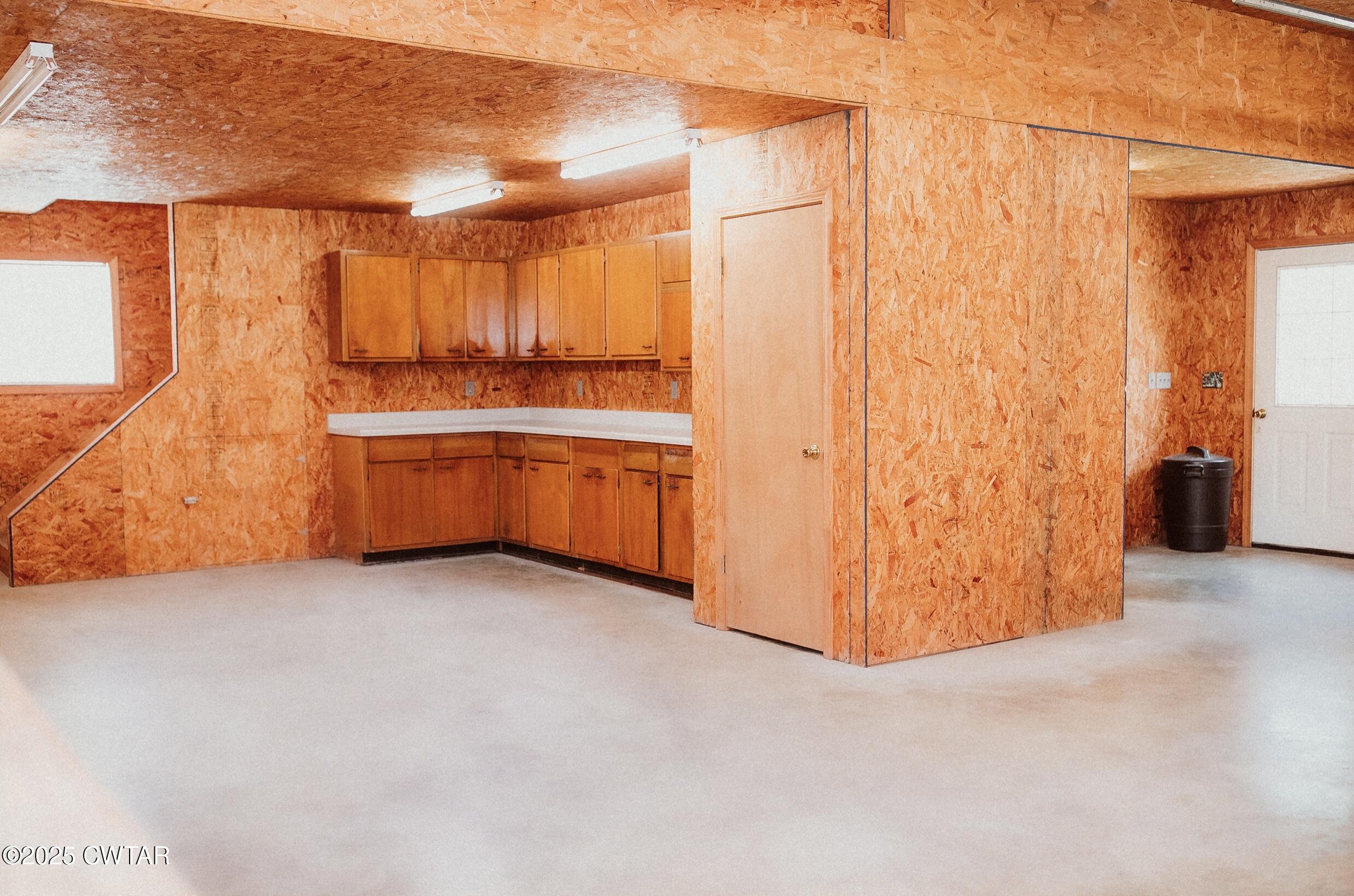 209 Hillside Street Kenton, TN 38233 - Photo 14 of 43 a view of an empty room with a fireplace