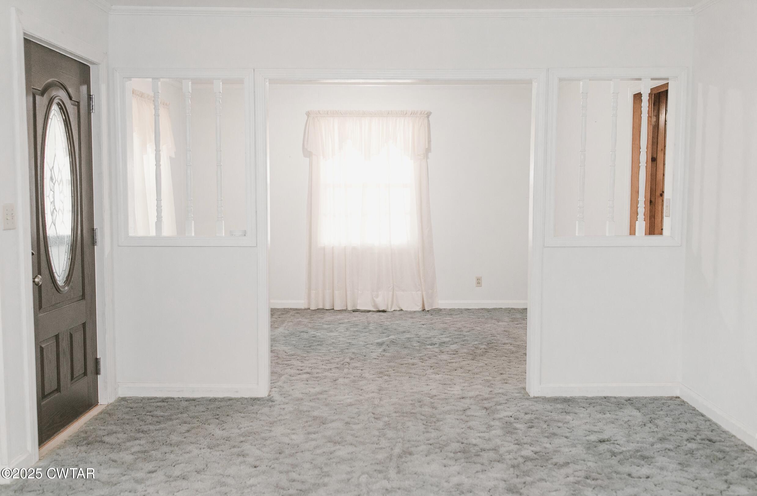 209 Hillside Street Kenton, TN 38233 - Photo 32 of 43 an empty room with windows