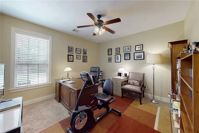 a work room with furniture and windows