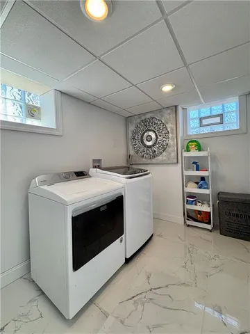 a utility room with washer and dryer
