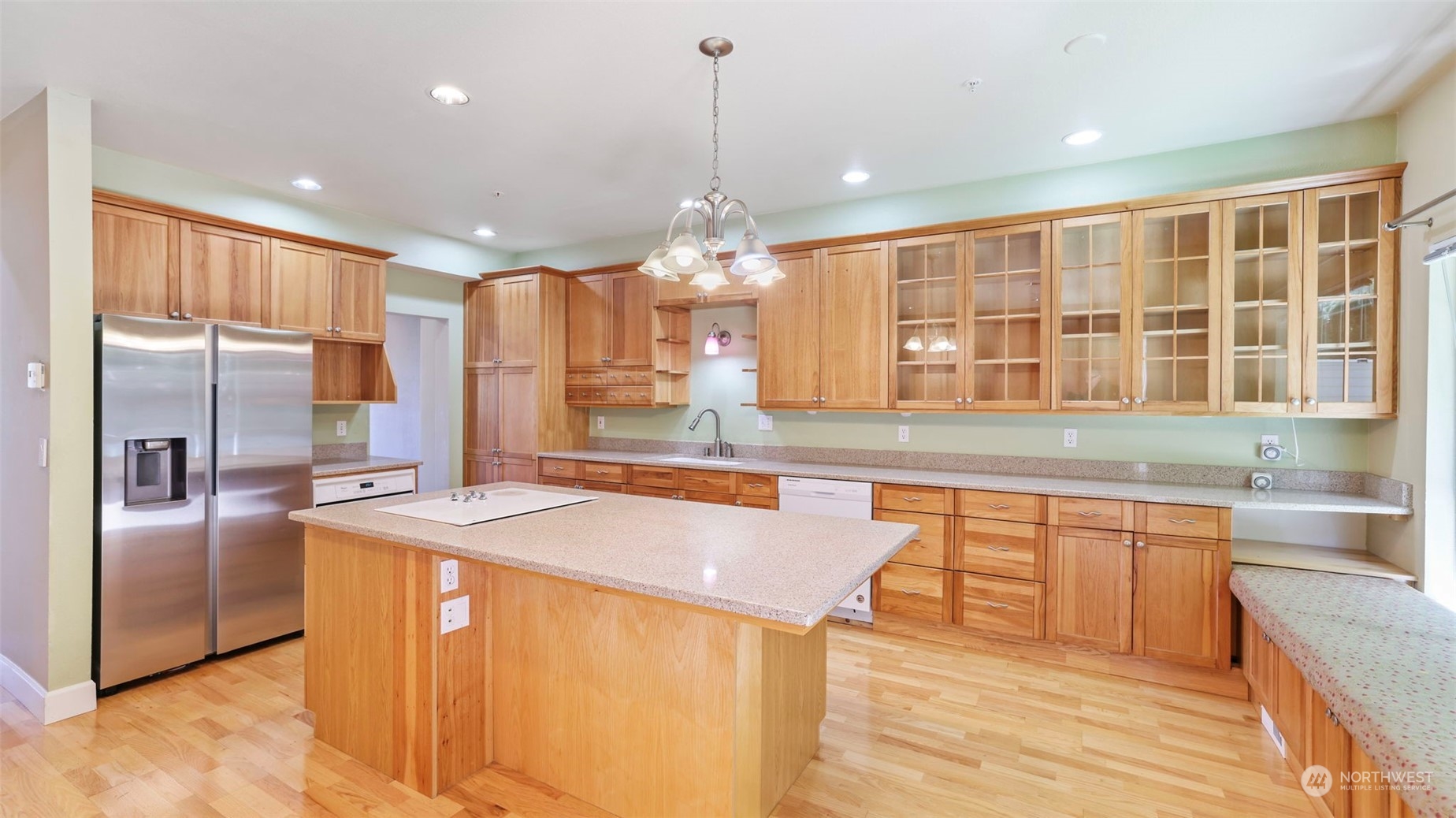 4640 Morris Avenue South Renton, WA 98055 - Photo 11 of 31 a kitchen with stainless steel appliances granite countertop a sink a stove and a refrigerator