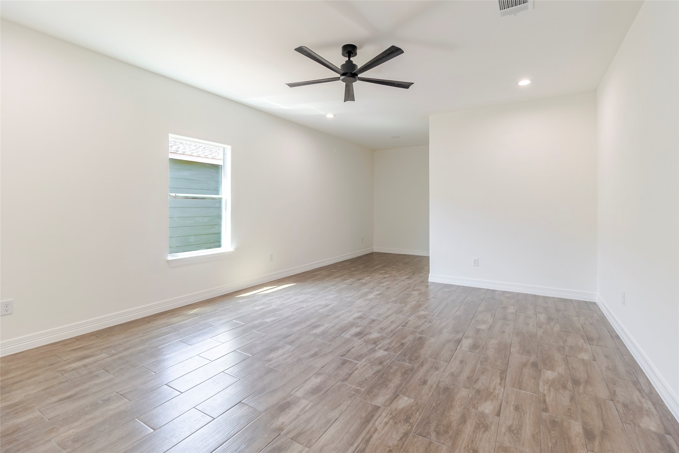 309 Myrtle Road Smithville, TX 78957 - Photo 9 of 17 The primary suite features its own ensuite bathroom and walk-in closet.