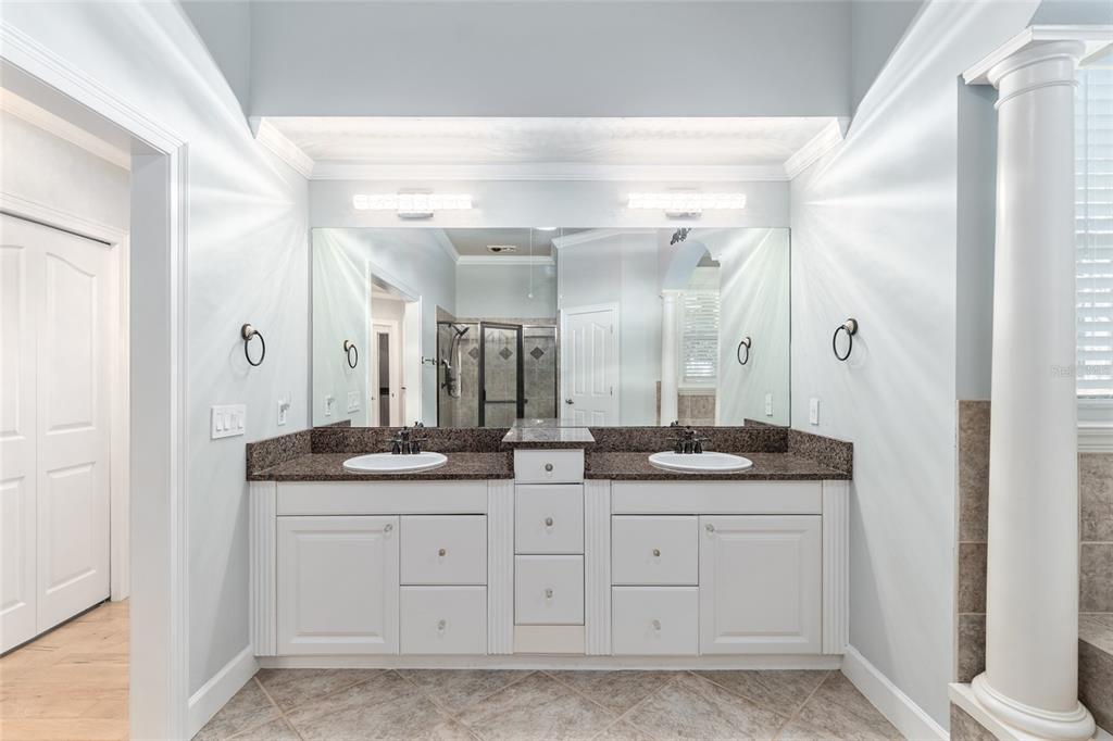 10614 Southwest 15th Lane Gainesville, FL 32607 - Photo 34 of 85 a bathroom with double sink and a mirror