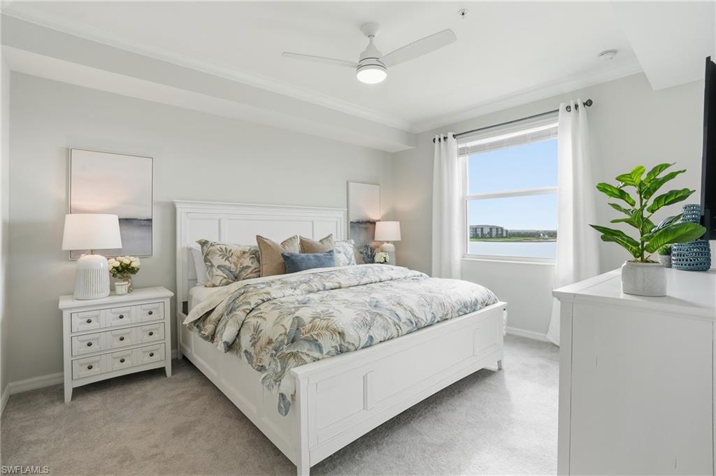 5555 Double Eagle Circle, Unit 3935 Ave Maria, FL 34142 - Photo 13 of 49 a bedroom with a bed and a potted plant