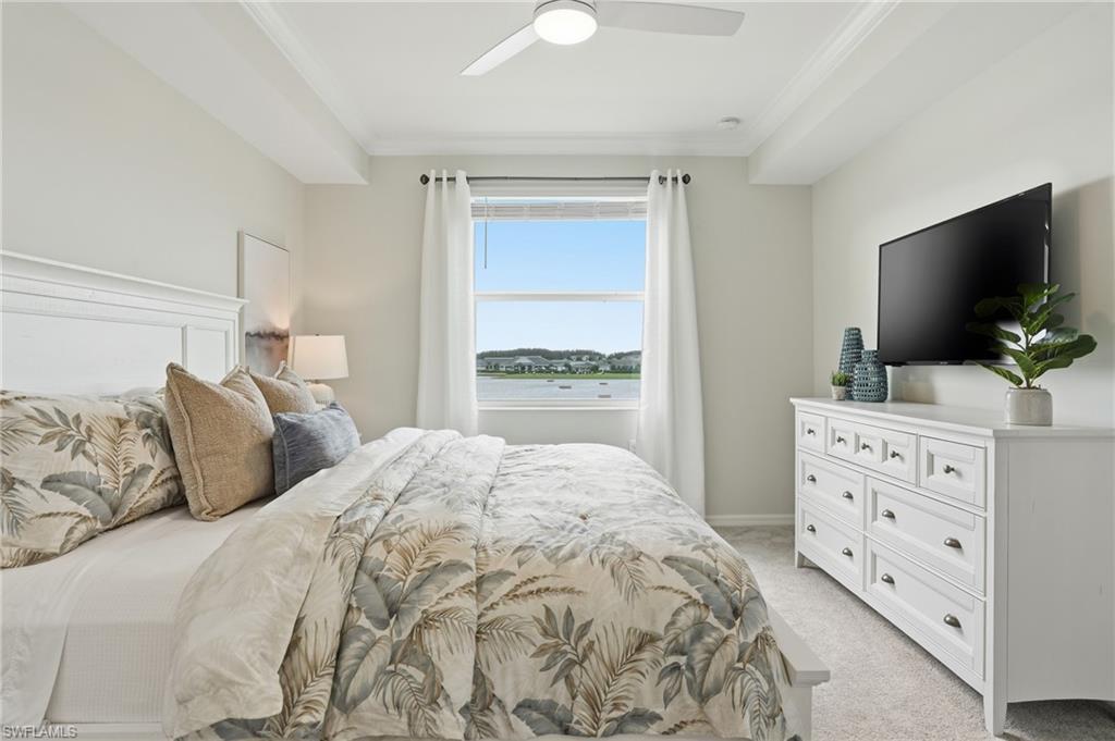 5555 Double Eagle Circle, Unit 3935 Ave Maria, FL 34142 - Photo 14 of 49 a bedroom with a bed and a flat screen tv