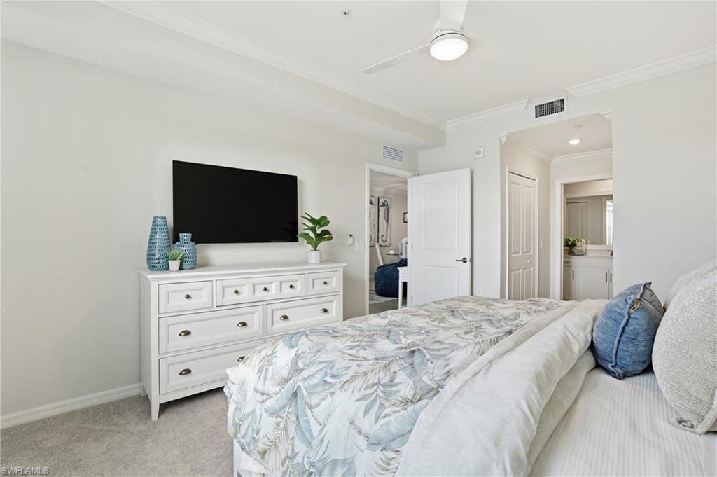 5555 Double Eagle Circle, Unit 3935 Ave Maria, FL 34142 - Photo 17 of 49 a bedroom with a bed and a flat screen tv
