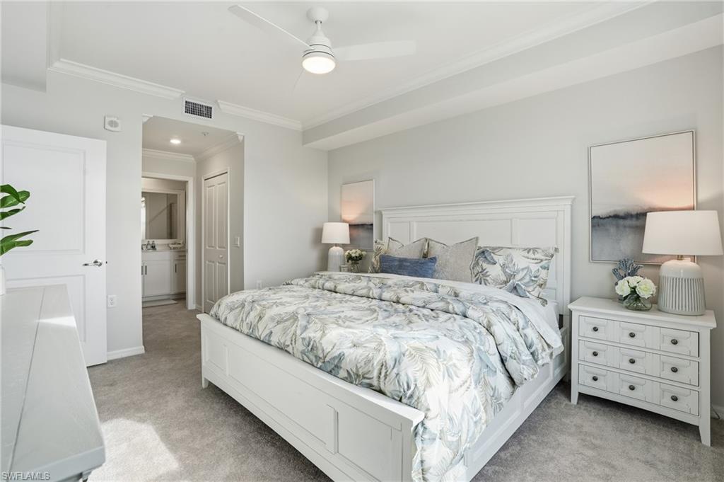 5555 Double Eagle Circle, Unit 3935 Ave Maria, FL 34142 - Photo 18 of 49 a bedroom with a bed and a night stand