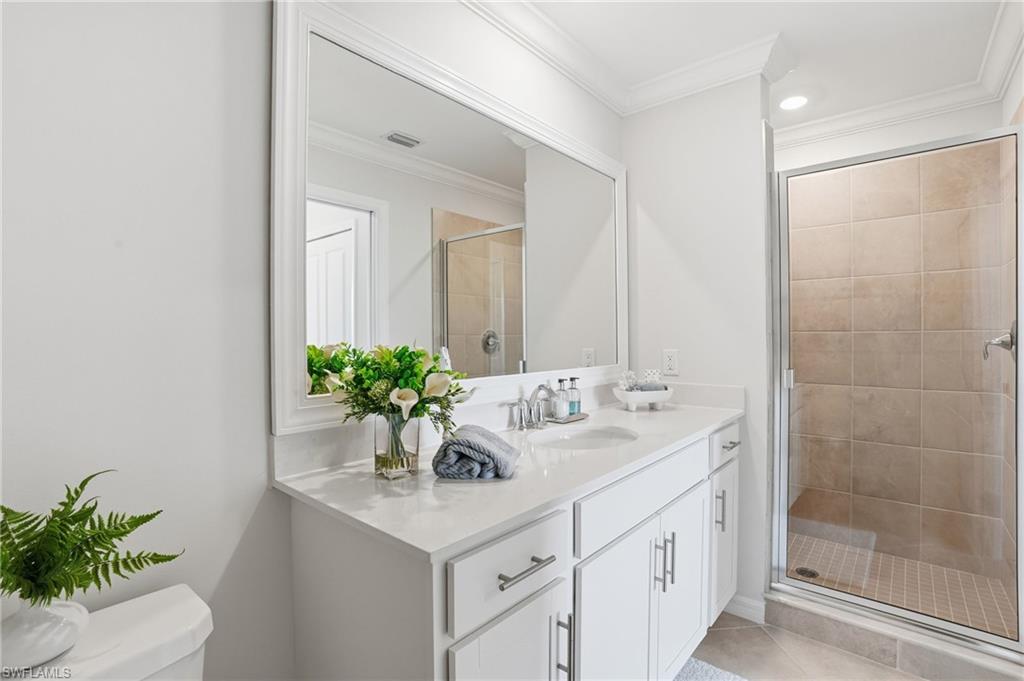 5555 Double Eagle Circle, Unit 3935 Ave Maria, FL 34142 - Photo 25 of 49 a bathroom with a sink a vanity and a mirror