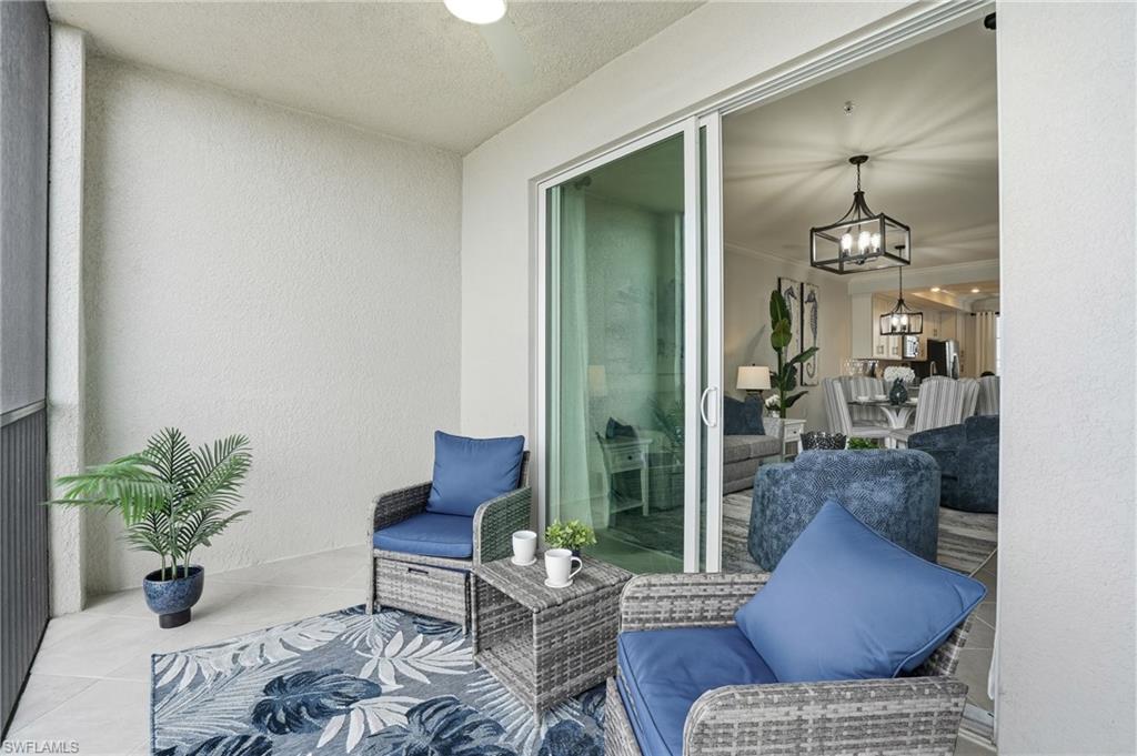 5555 Double Eagle Circle, Unit 3935 Ave Maria, FL 34142 - Photo 28 of 49 a living room with furniture and a potted plant