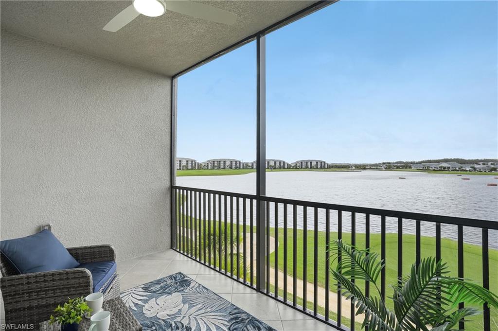 5555 Double Eagle Circle, Unit 3935 Ave Maria, FL 34142 - Photo 29 of 49 a balcony with wooden floor