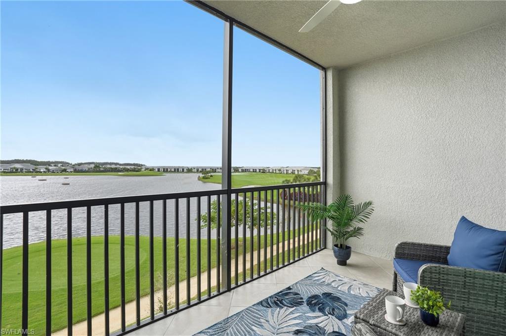 5555 Double Eagle Circle, Unit 3935 Ave Maria, FL 34142 - Photo 30 of 49 a view of a chairs and table in patio