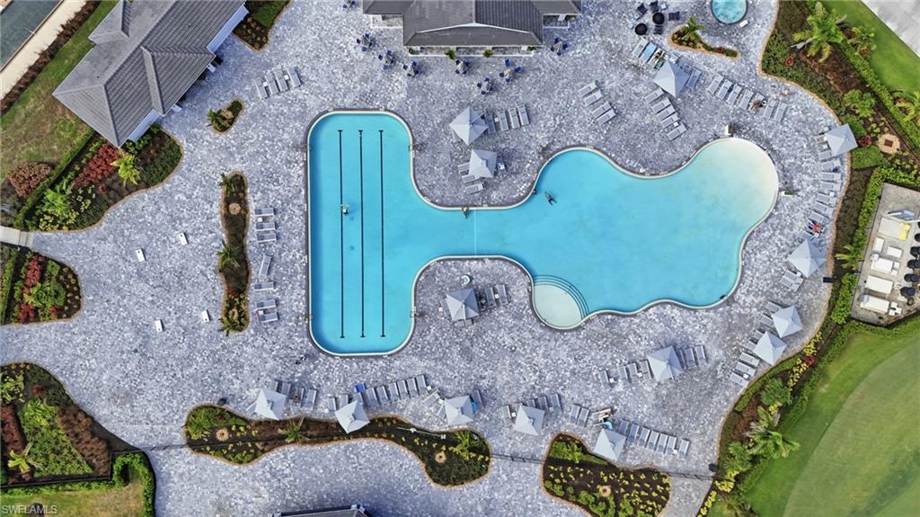 5555 Double Eagle Circle, Unit 3935 Ave Maria, FL 34142 - Photo 41 of 49 an aerial view of a fireplace with table and chairs