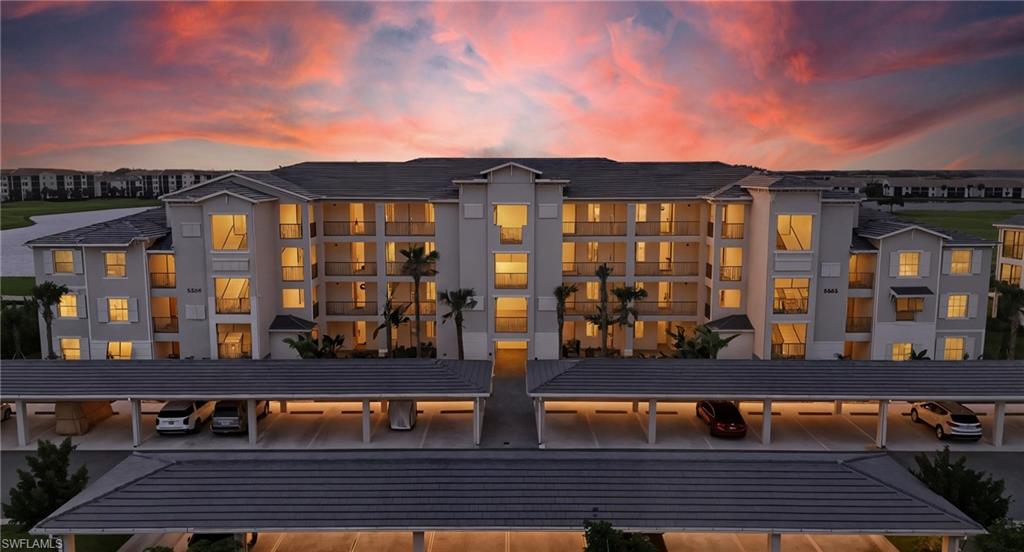 5555 Double Eagle Circle, Unit 3935 Ave Maria, FL 34142 - Photo 47 of 49 a view of a brick building with many windows