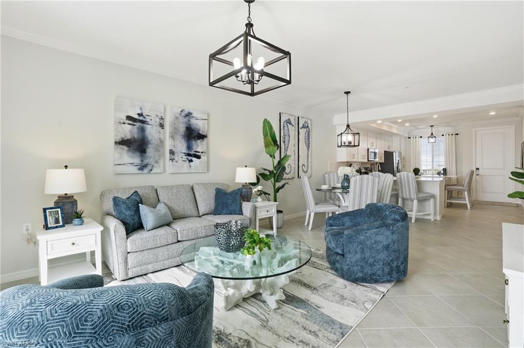 5555 Double Eagle Circle, Unit 3935 Ave Maria, FL 34142 - Photo 5 of 49 a living room with furniture and a chandelier